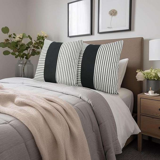 Black and white geometric abstract minimalist throw pillow cover on a modern sofa, perfect for stylish living room decor and mixing and matching with other decorative pillows.
