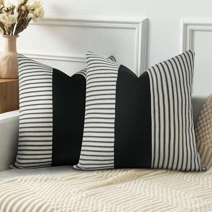 Black and white geometric abstract minimalist throw pillow cover on a modern sofa, perfect for stylish living room decor and mixing and matching with other decorative pillows.